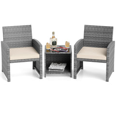 3 Piece Patio Rattan Bistro Set, 2 Grey Wicker Chairs Rated 400 lb with Beige Seat Cushions and an 18 in Glass Top Table with Shelf