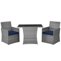 3 Piece Patio Wicker Dining Set, 2 Grey Armchairs Rated 350 lb with Navy Cushions that Tuck Under a 41 in Glass Top Table