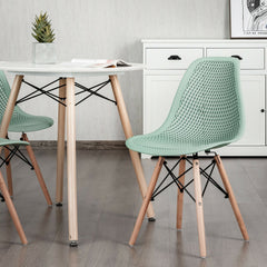 Pair of Modern Sage Green Shell Dining Chairs with Perforated Seat and Beech Wood Legs
