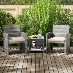 3 Piece Patio Rattan Bistro Set, 2 Grey Wicker Chairs Rated 400 lb with Beige Seat Cushions and an 18 in Glass Top Table with Shelf