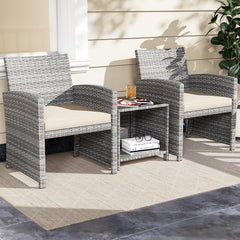 3 Piece Patio Rattan Bistro Set, 2 Grey Wicker Chairs Rated 400 lb with Beige Seat Cushions and an 18 in Glass Top Table with Shelf