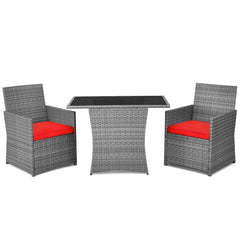 3 Piece Patio Wicker Dining Set, 2 Grey Armchairs Rated 350 lb with Red Cushions that Tuck Under a 41 in Glass Top Table