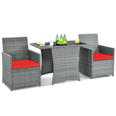 3 Piece Patio Wicker Dining Set, 2 Grey Armchairs Rated 350 lb with Red Cushions that Tuck Under a 41 in Glass Top Table