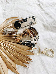Itzy Ritzy Pacifier Case With Clip – Pacifier Charm Pod Includes Clasp to Easily Attach to a Diaper Bag or Purse; Measures 2.5” in Diameter and Holds 2 Pacifiers, Leopard
